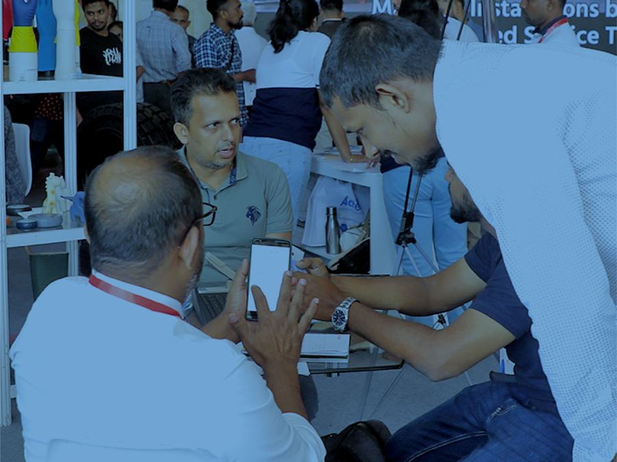 Business meetings on the show floor at COMPLAST Sri Lanka